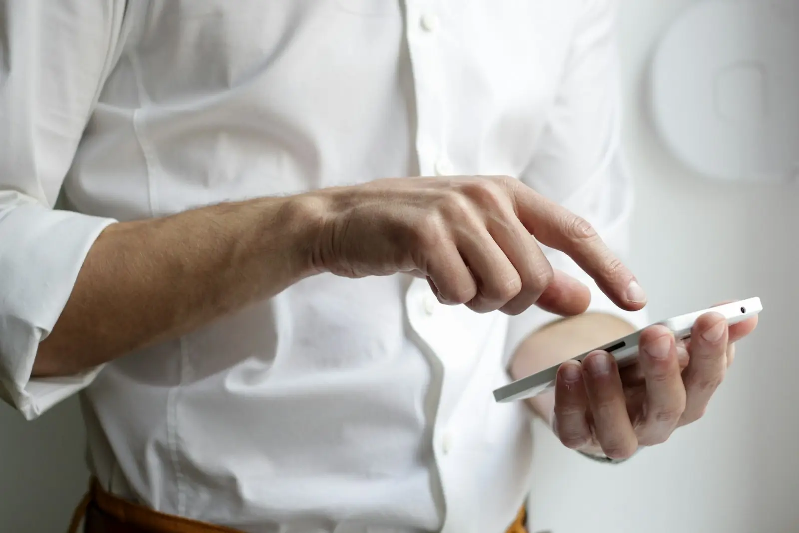 A guest checking a message on their phone